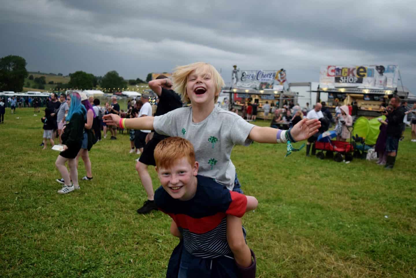 Little girl on her brother's back at YNotFestival