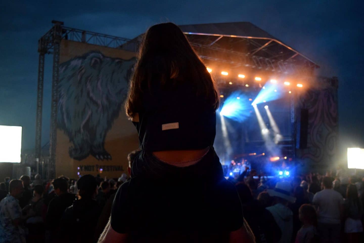 Chloe sat on Dave's shoulders watching Elbow at Y Not Festival