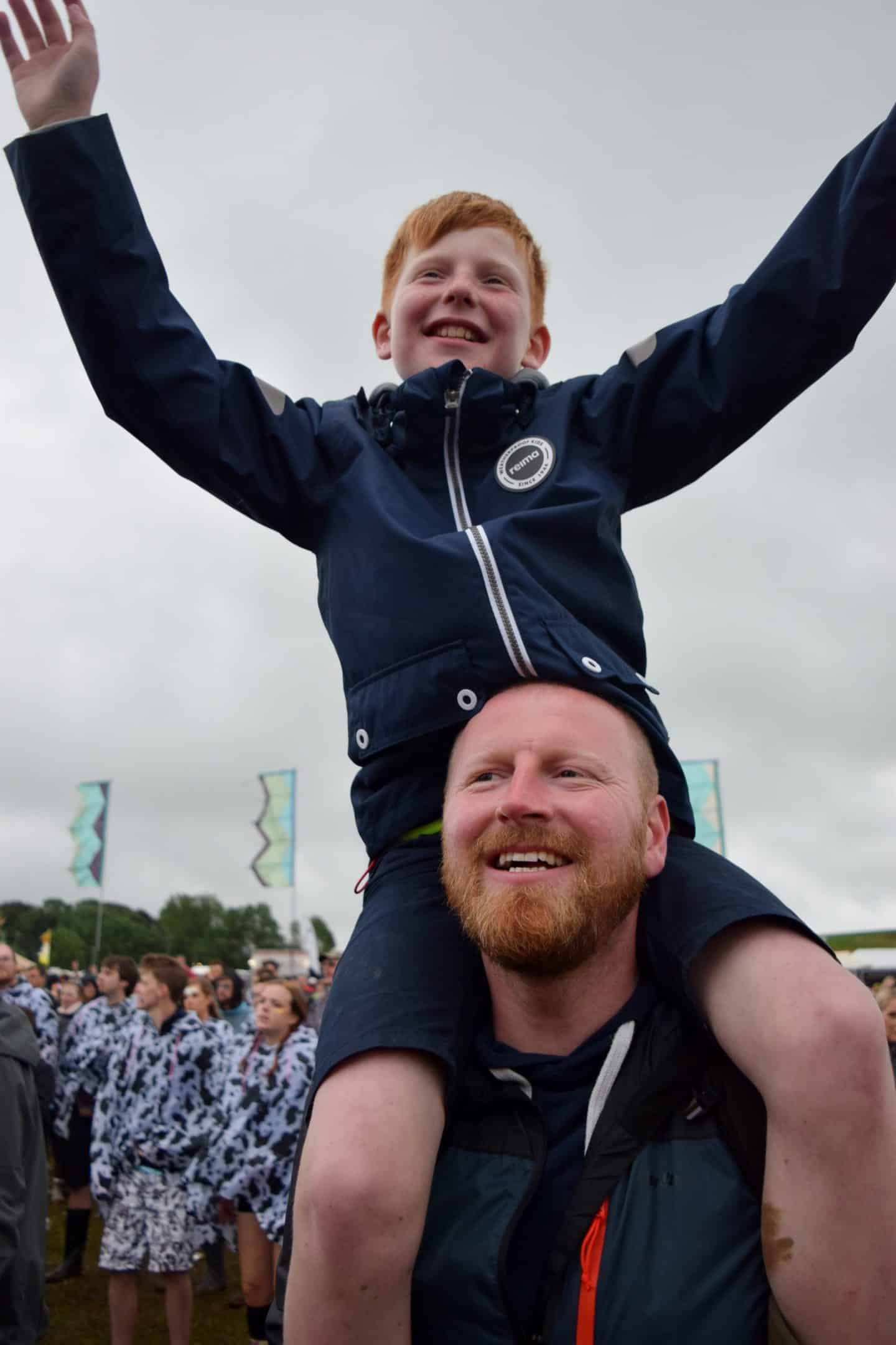 Young lad sitting on his Dad's shoulders at Y Not Festival