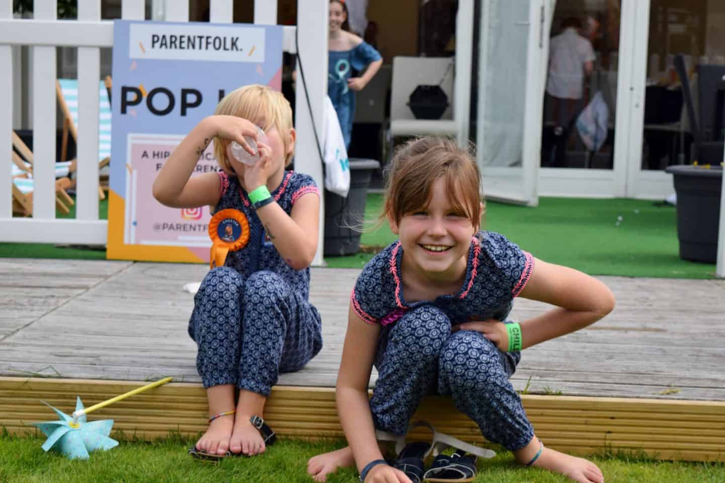 Girls wearing matching jumpsuits at Chester Races with ParentFolk