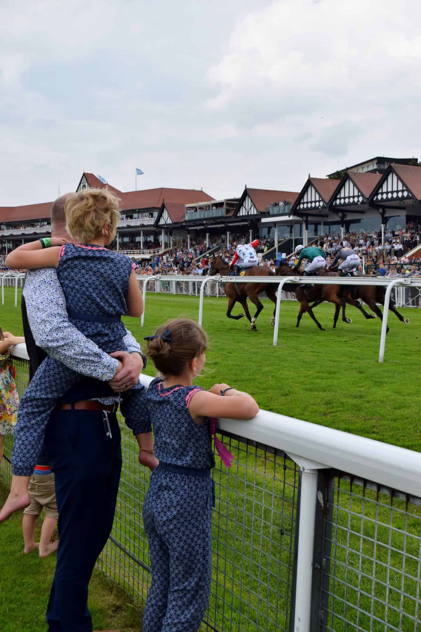 Under 18s Race Free - Dad watching horse racing with children