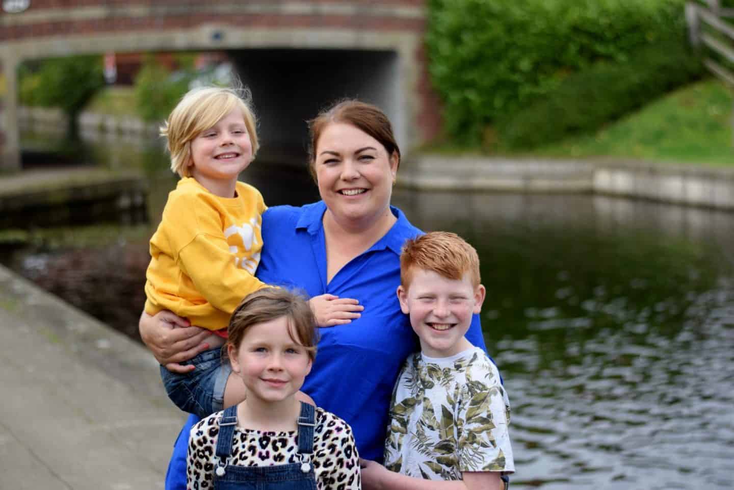 Smiling mum with three children