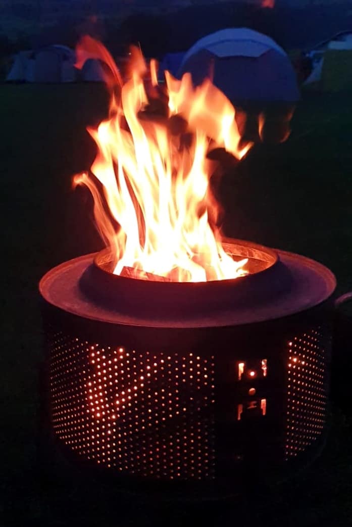 Roaring campfire at night at Catgill Farm campsite