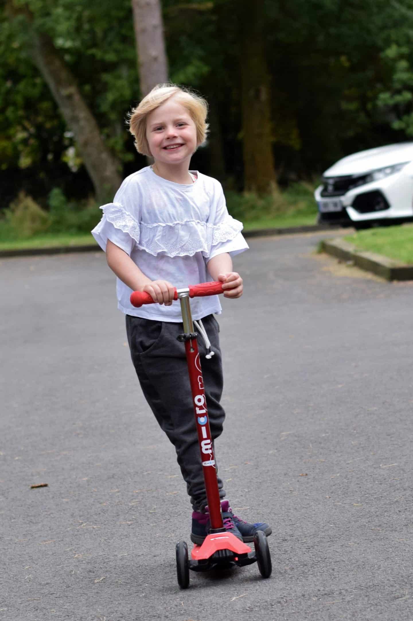 Little girl on her microscooter