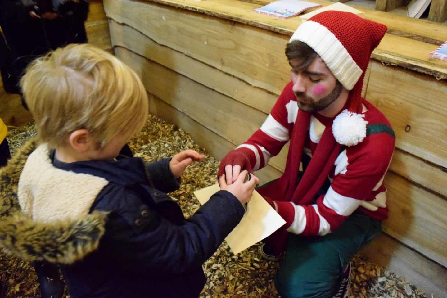 Stamping the letter to post to Santa