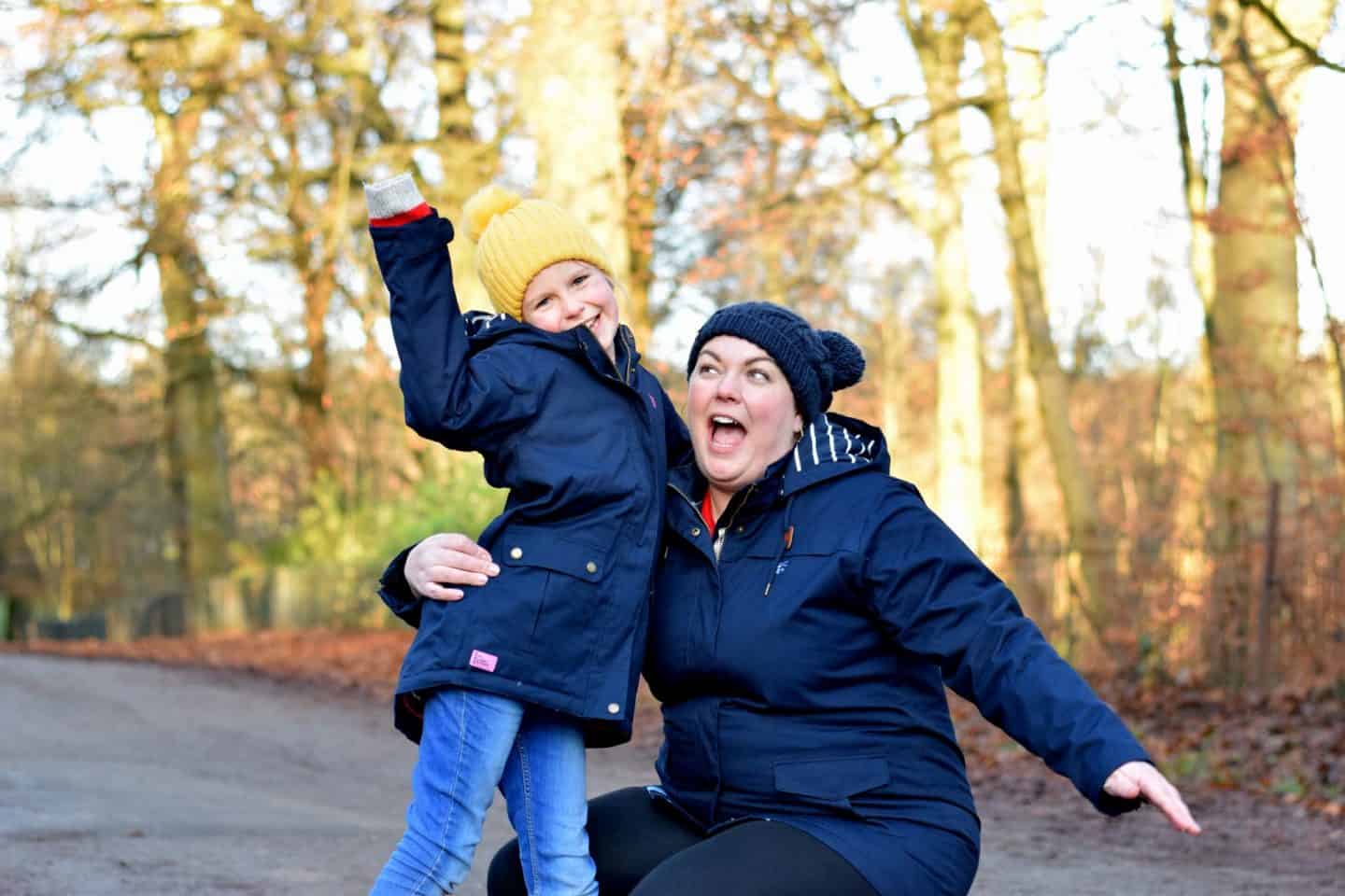 Mother and daughter in matching navy coats
