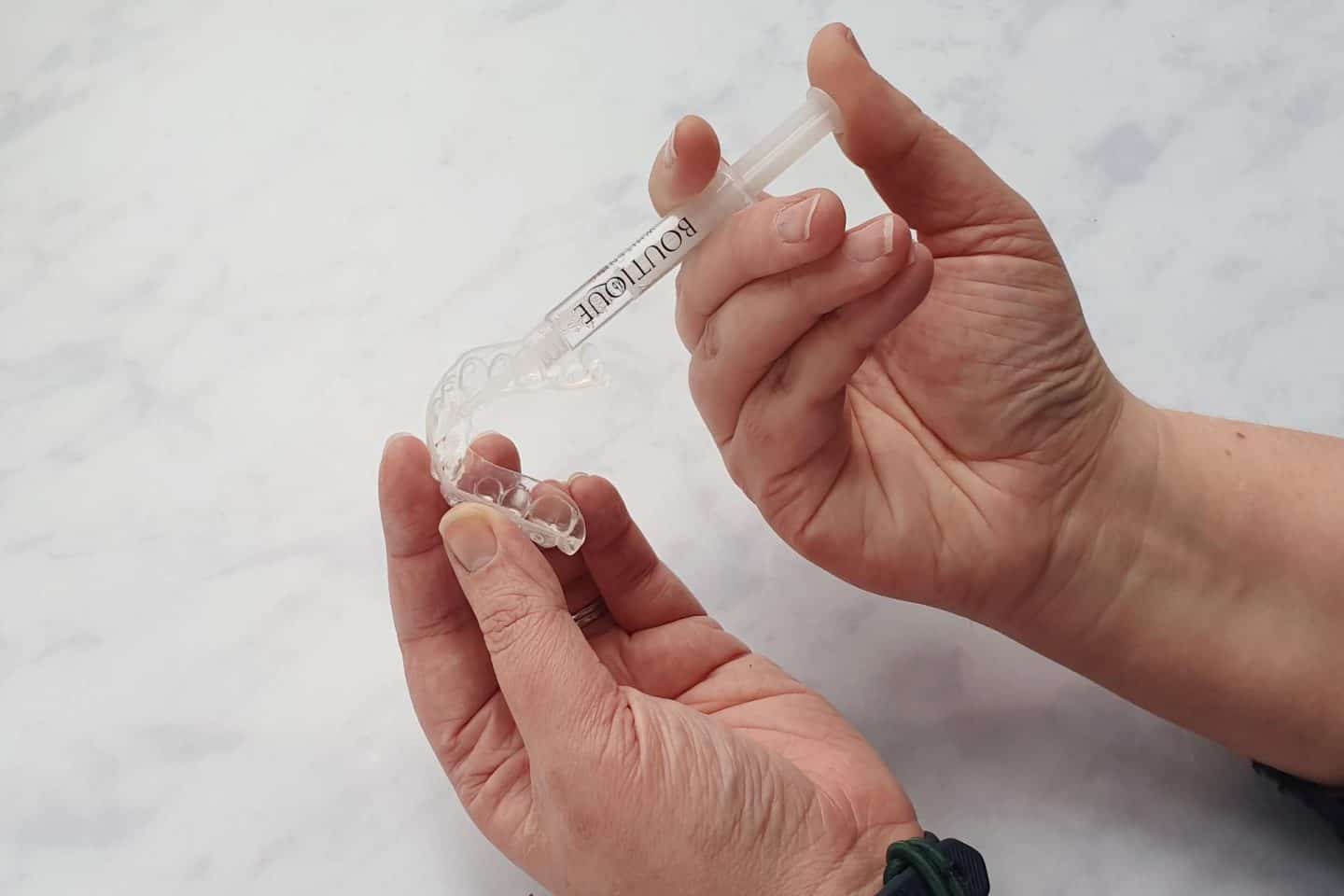 The whitening product comes in a syringe which you dot into your custom made teeth whitening trays