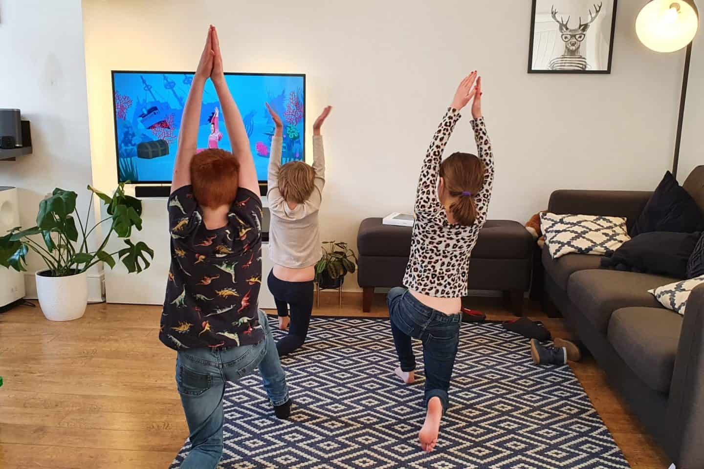 Kids doing Cosmic Yoga in on youtube during school closures