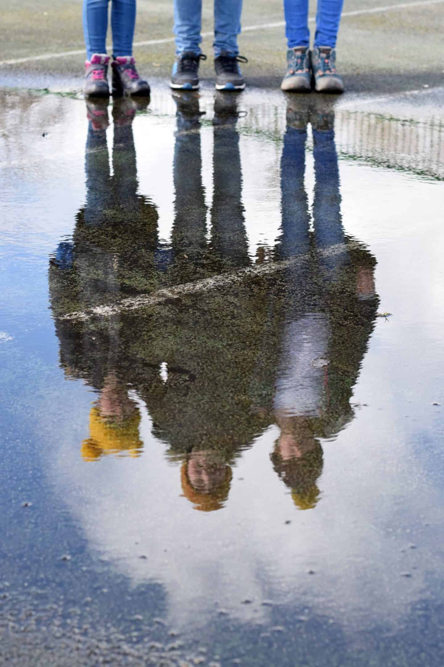 Puddleography - three kids reflections in a puddle