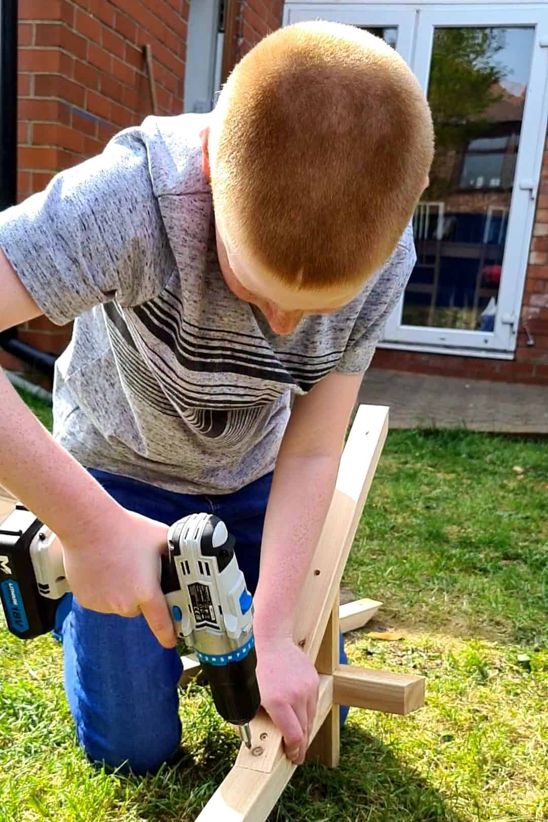 boy with electric screwdriver