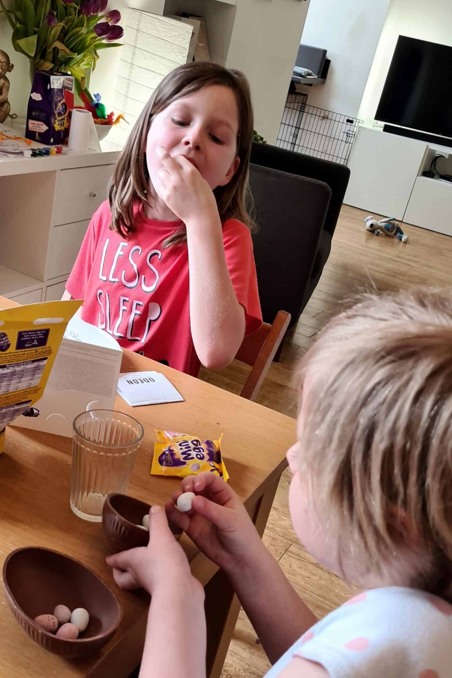 Children eating Cabury mini egg easter eggs