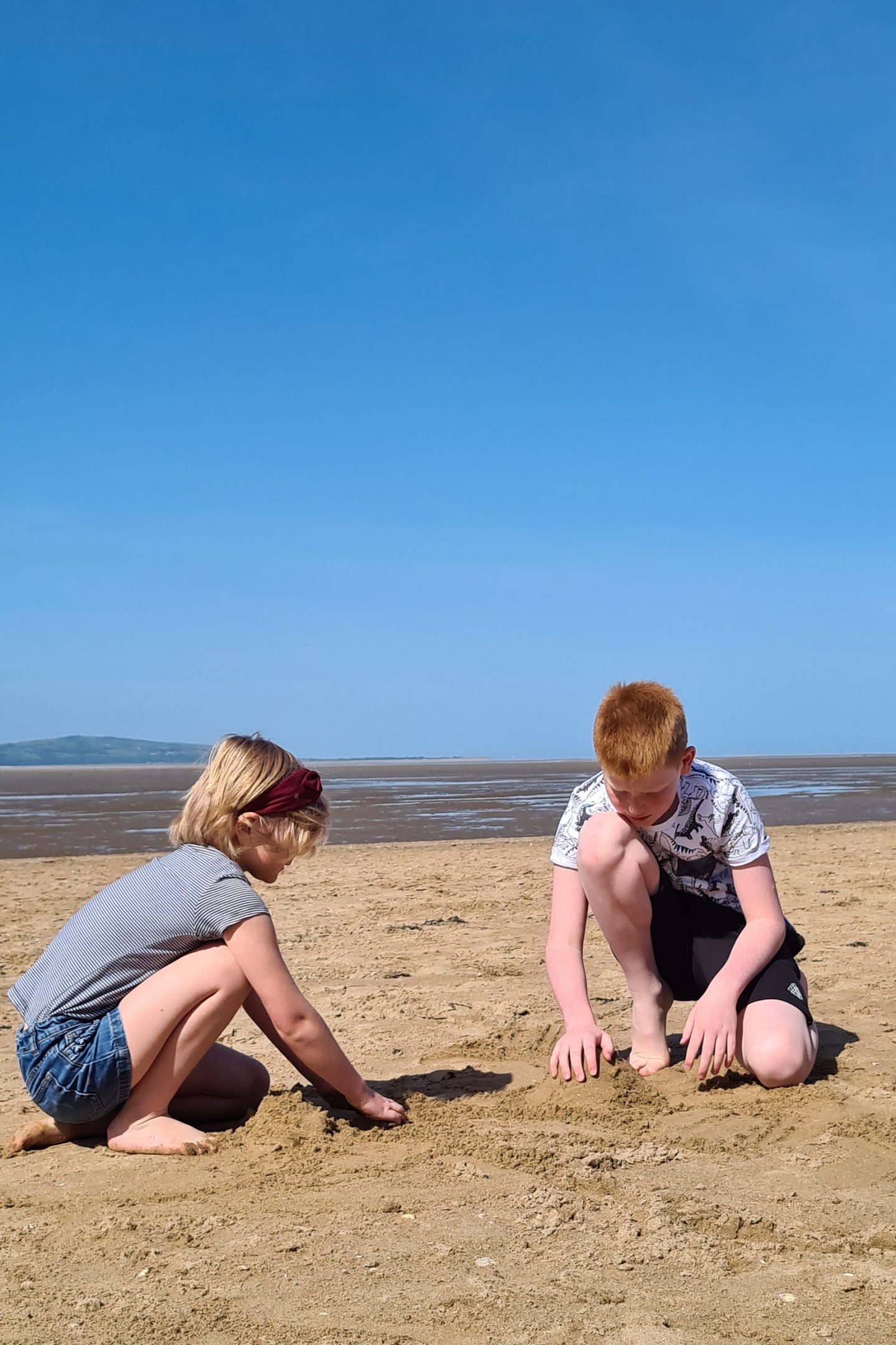 Children playing on the beach in West Kirby