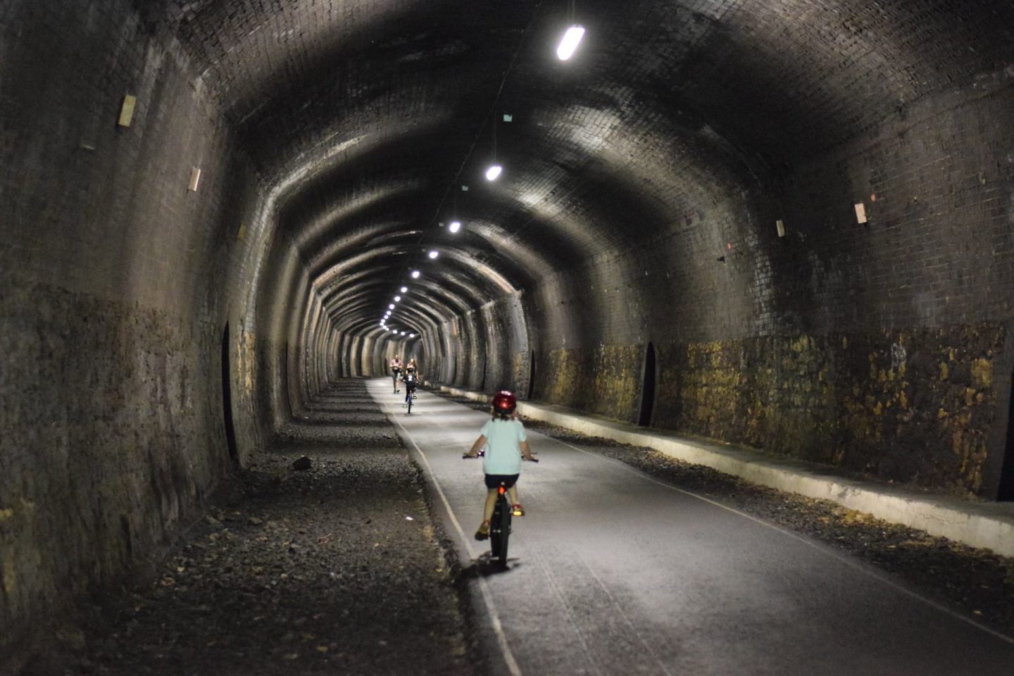 Cycling through a disused railway tunnel