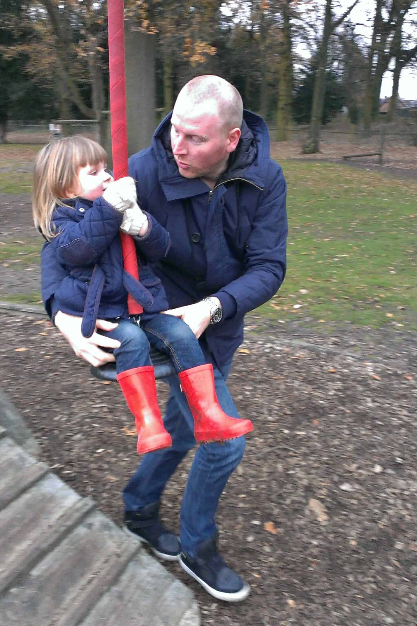Little girl on the zipline in the adventure playground