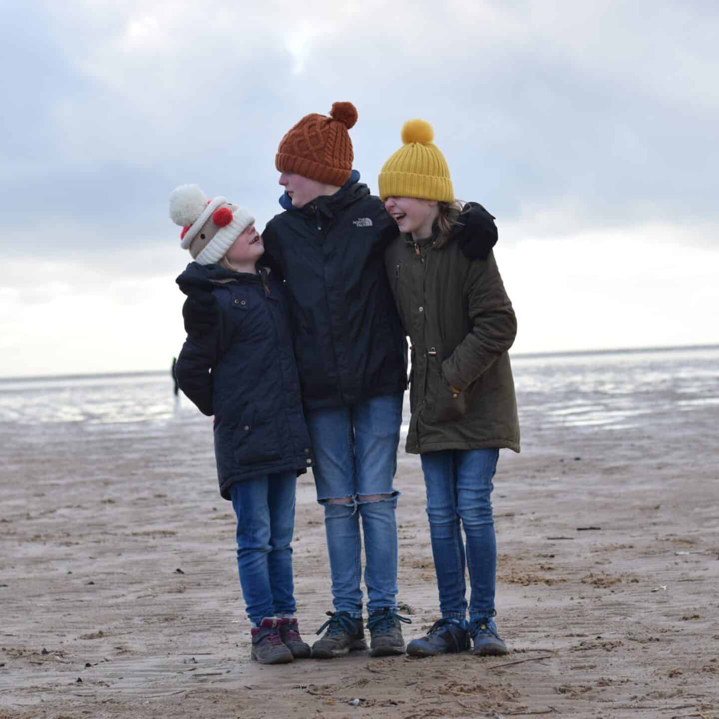 We're going on an adventure - three kids on the beach in the winter