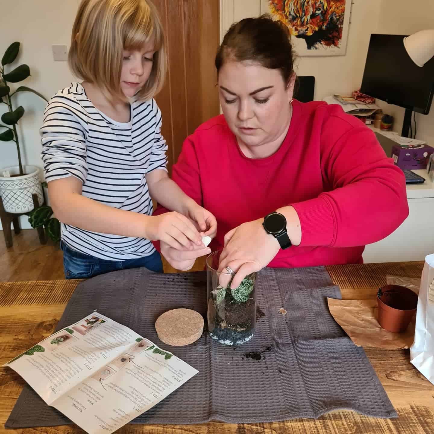 Mother and daughter planting together
