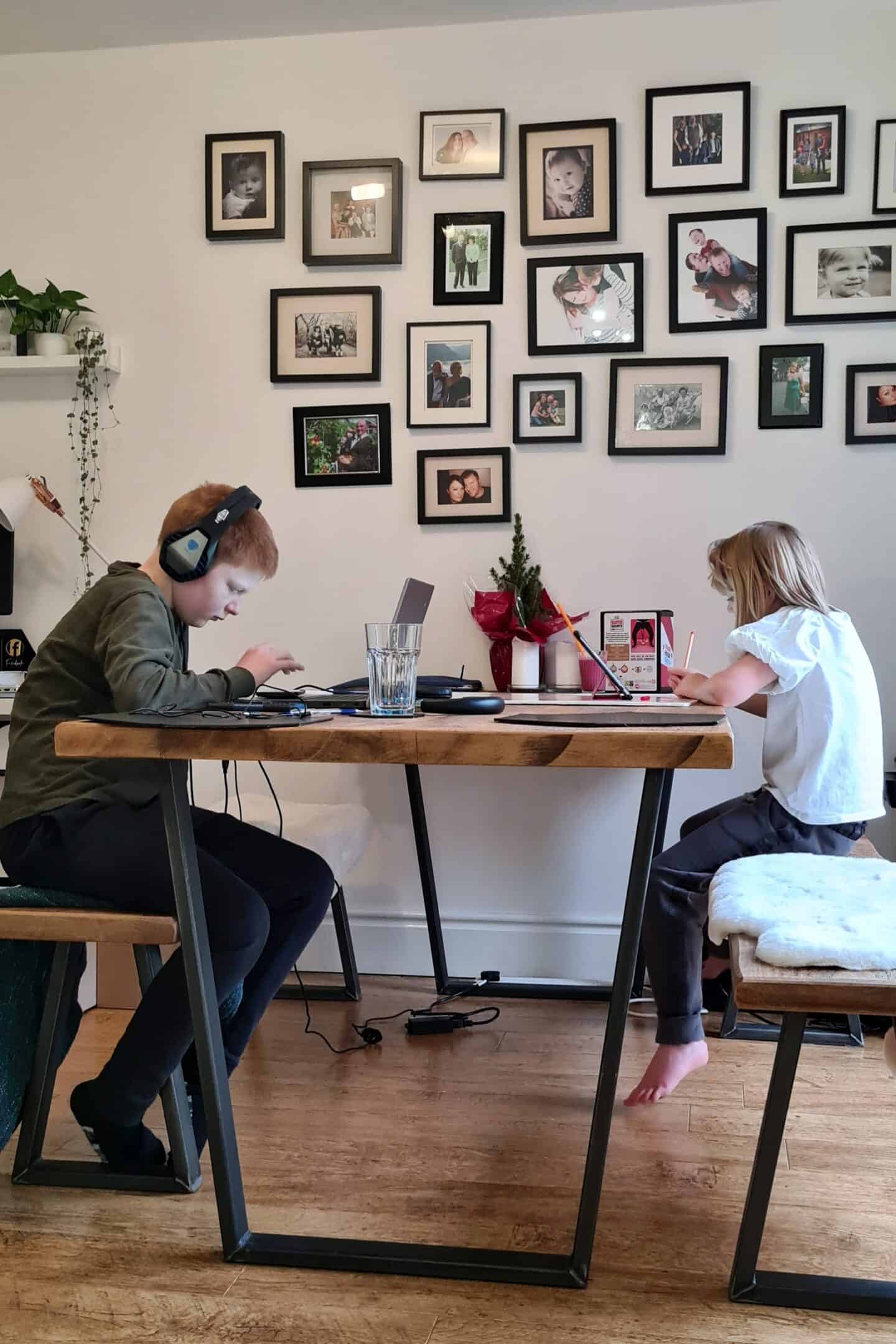 Children sitting at the dining table doing their home learning during lockdown 3