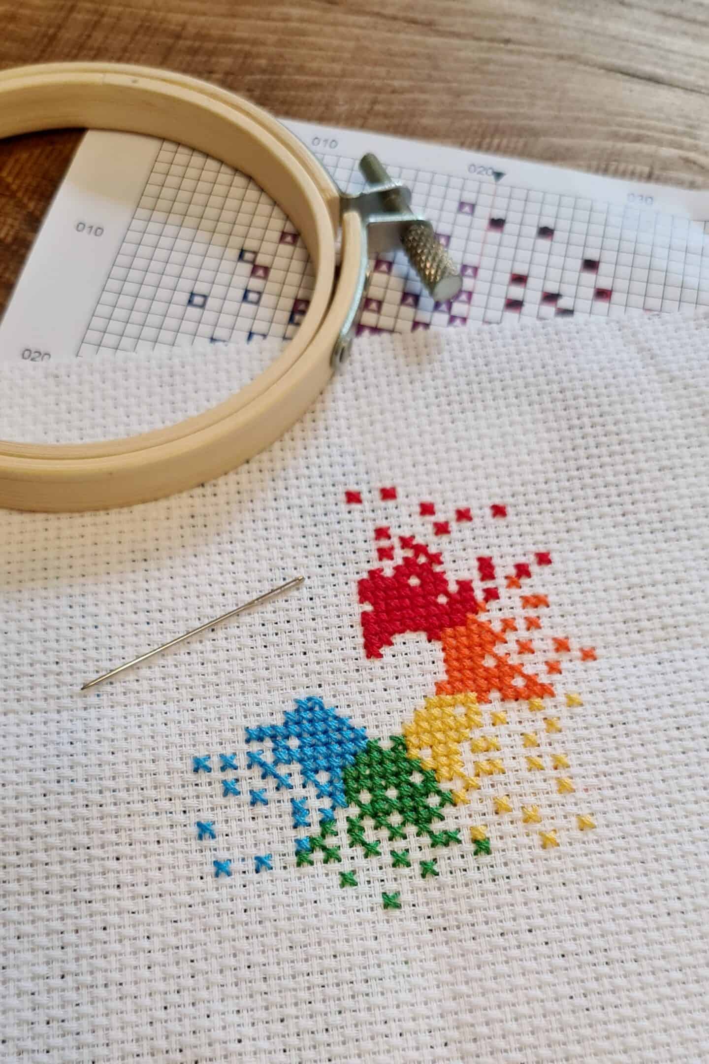 Rainbow heart cross stitch in progress