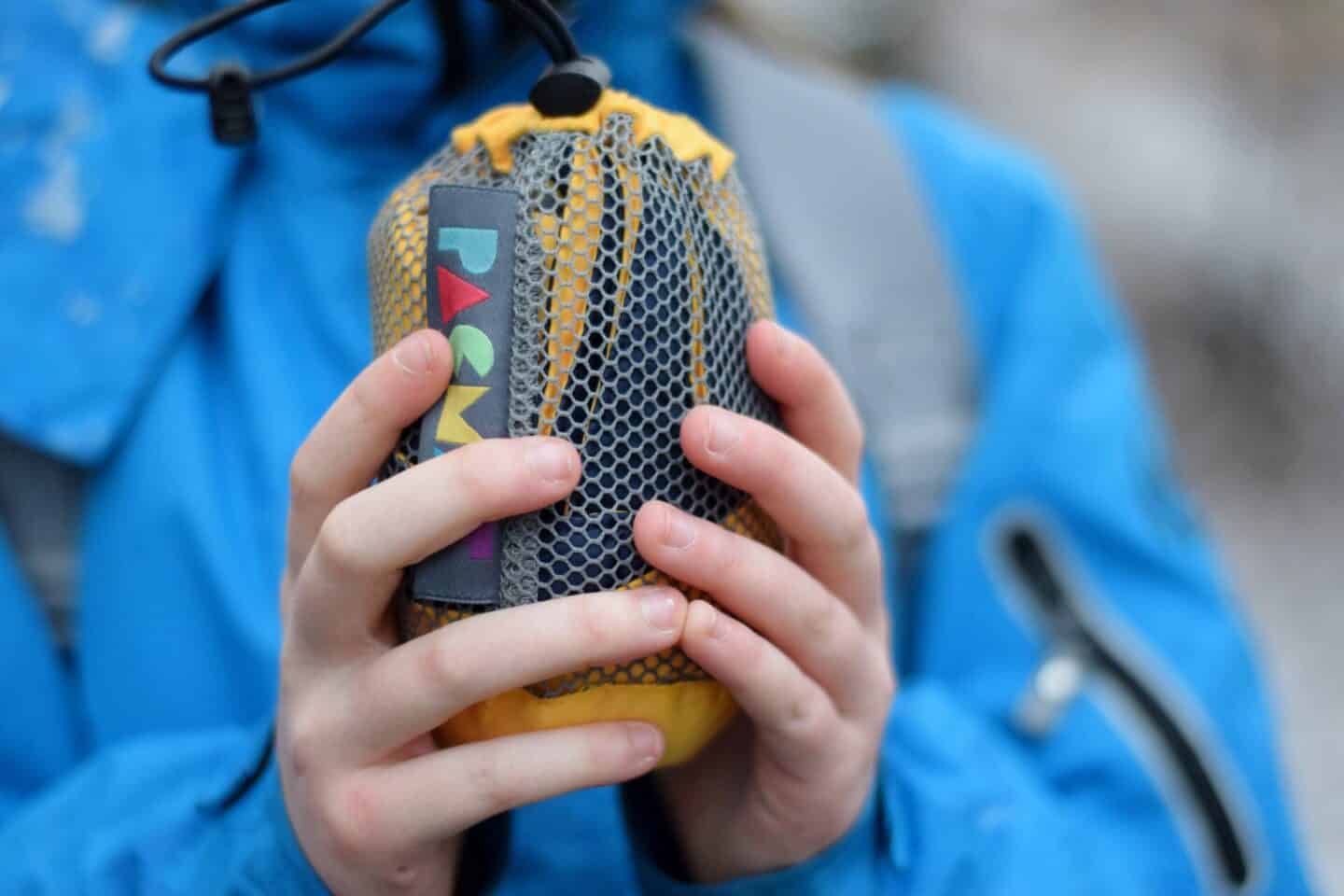 Yellow Rubbastuff patch in a mesh bag for easy carrying and storing