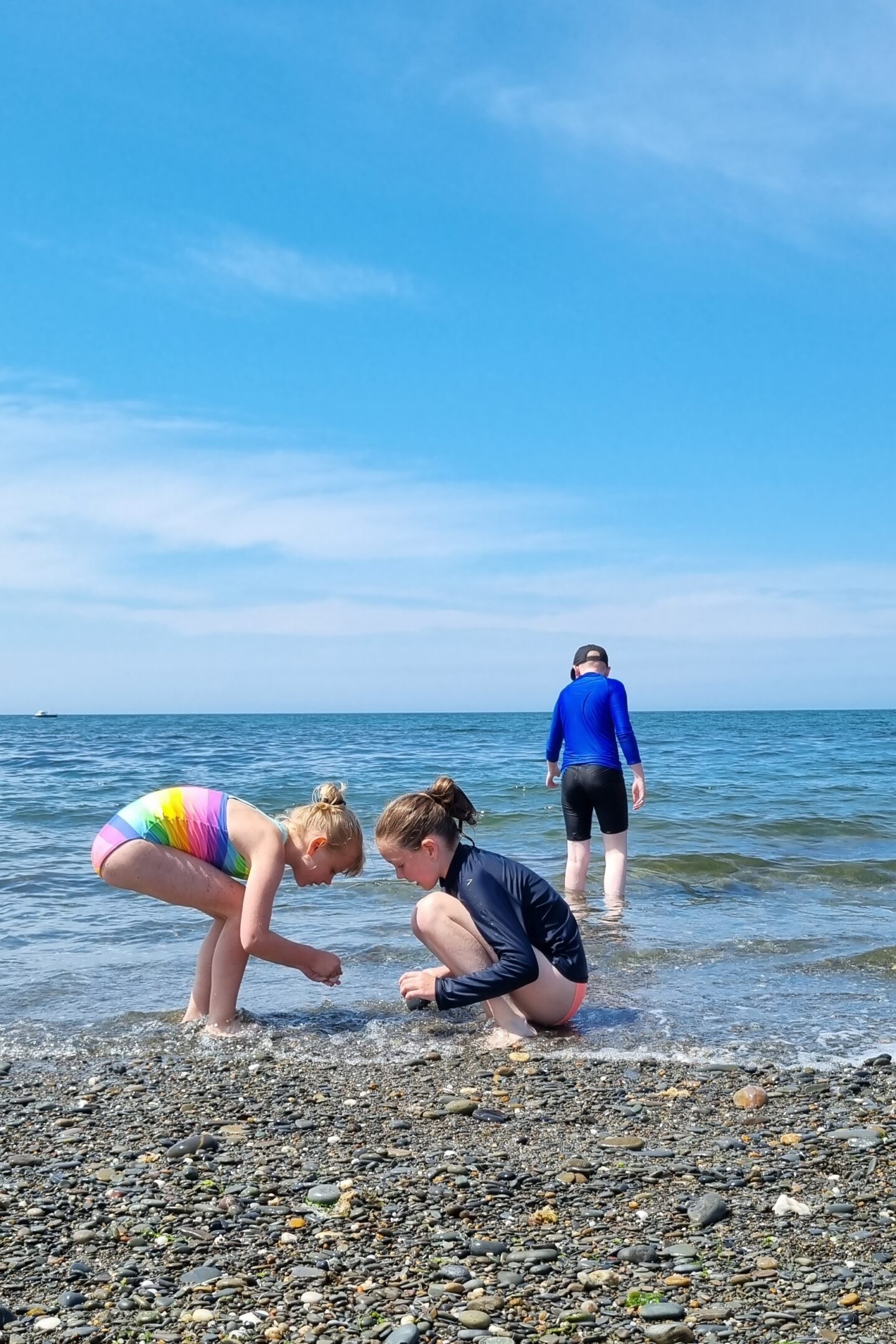 Kids playing on the beach in Wales
