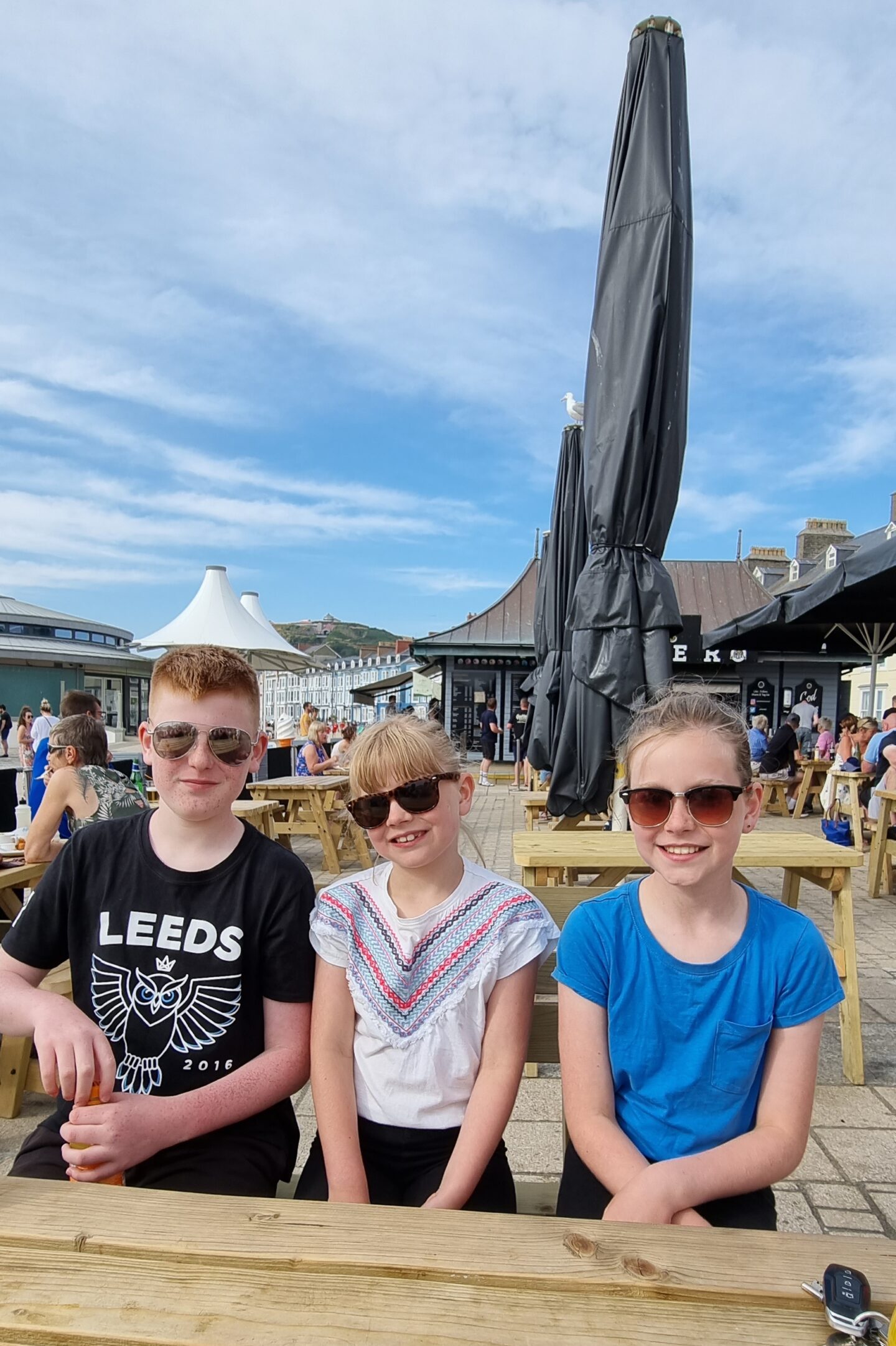 Kids waiting for their tea at PD's Diner on the beach in Aberystwyth