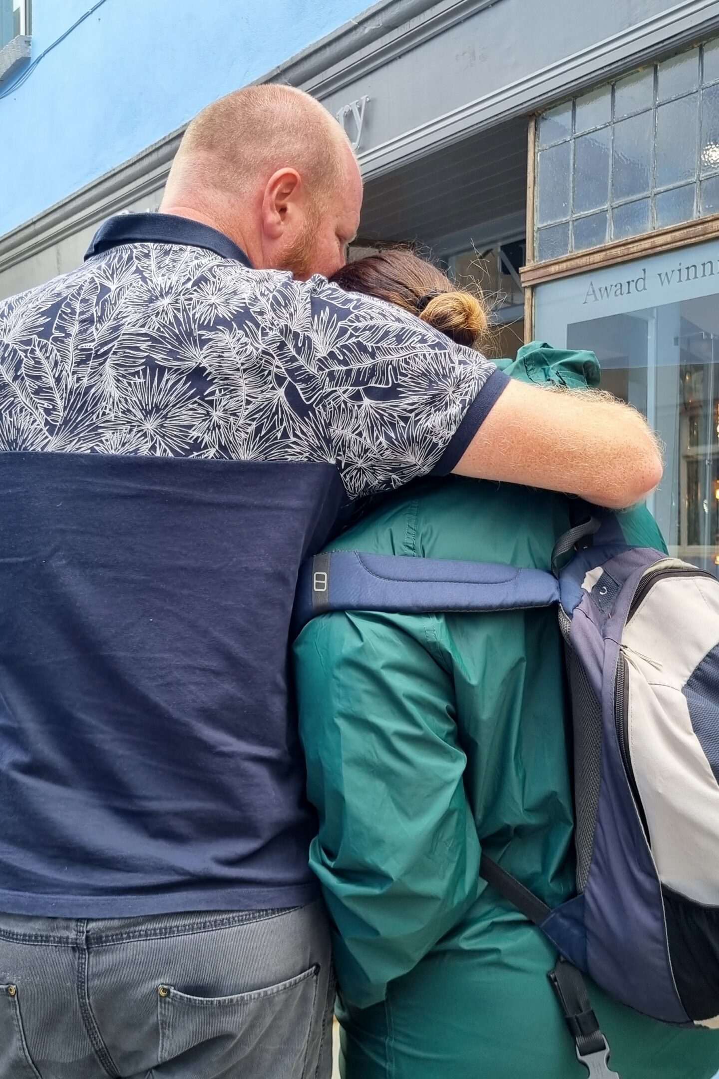 A cuddle outside the jewellers in Llandeilo