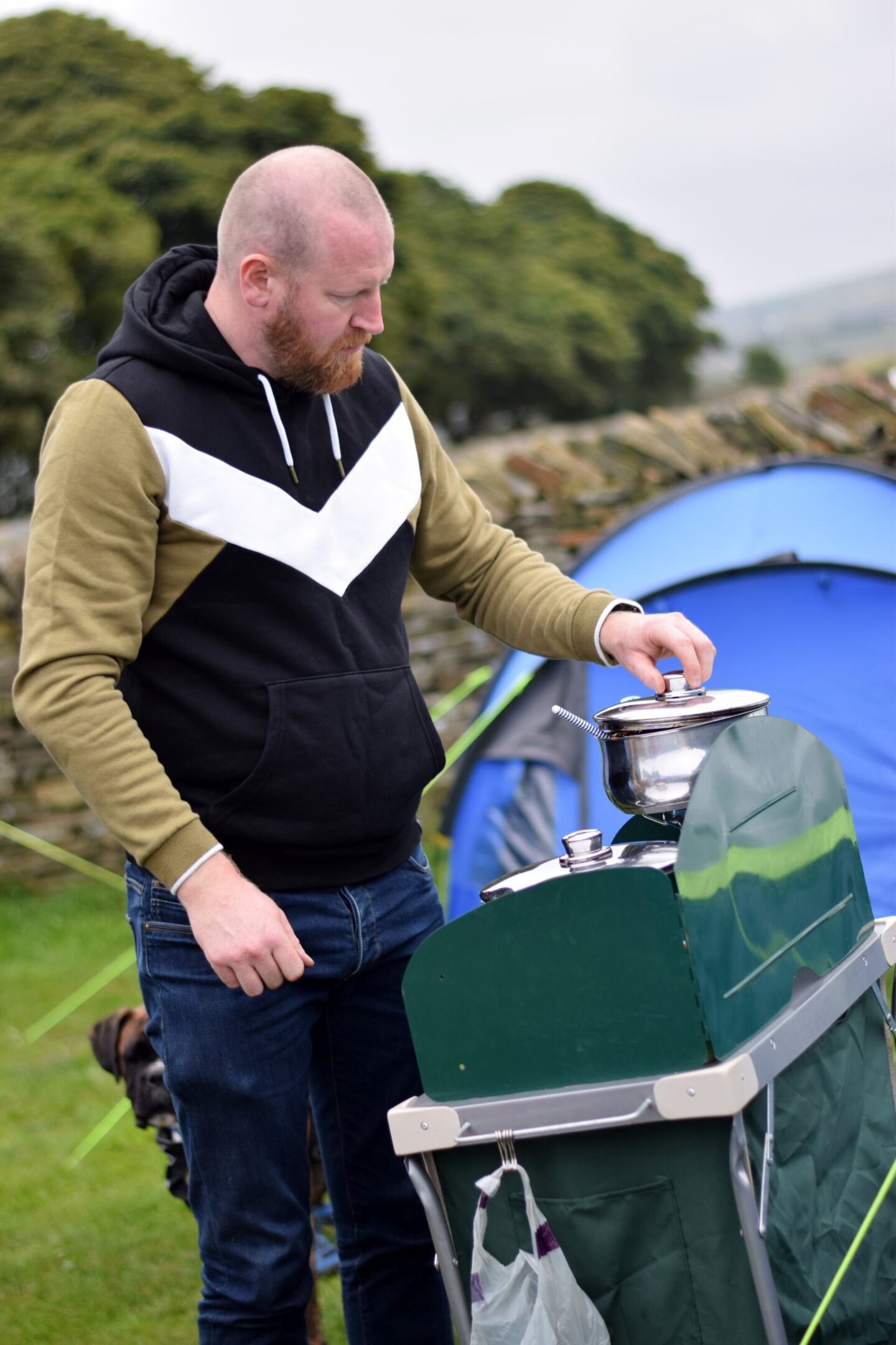 Dave re-heating a chilli on the camping stove