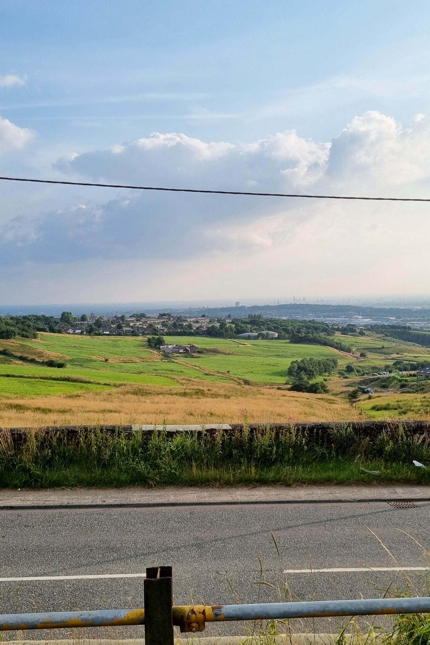 View from The Black Ladd, Shaw over Manchester on a sunny summer's evening