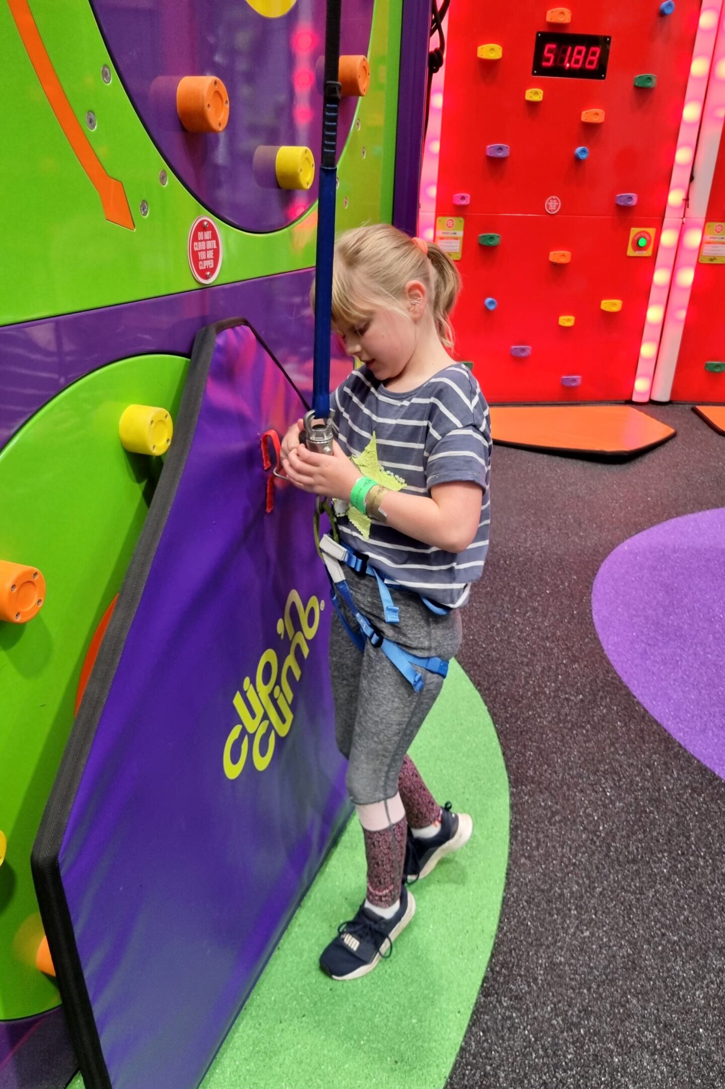 The mats at Clip n Climb show when a climbing wall is free to use