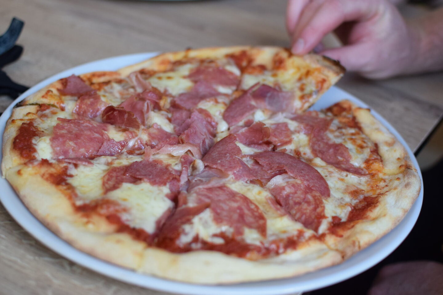 Stone-baked pizza with delicious meat toppings
