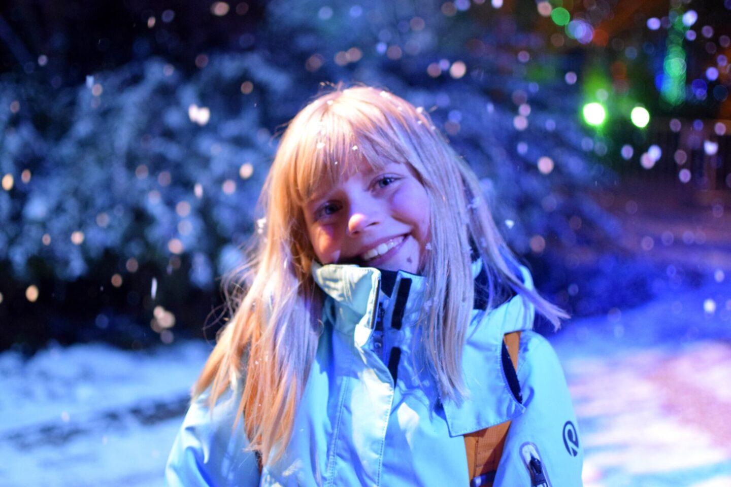 Amy wrapped up in the snow at Dunham Massey