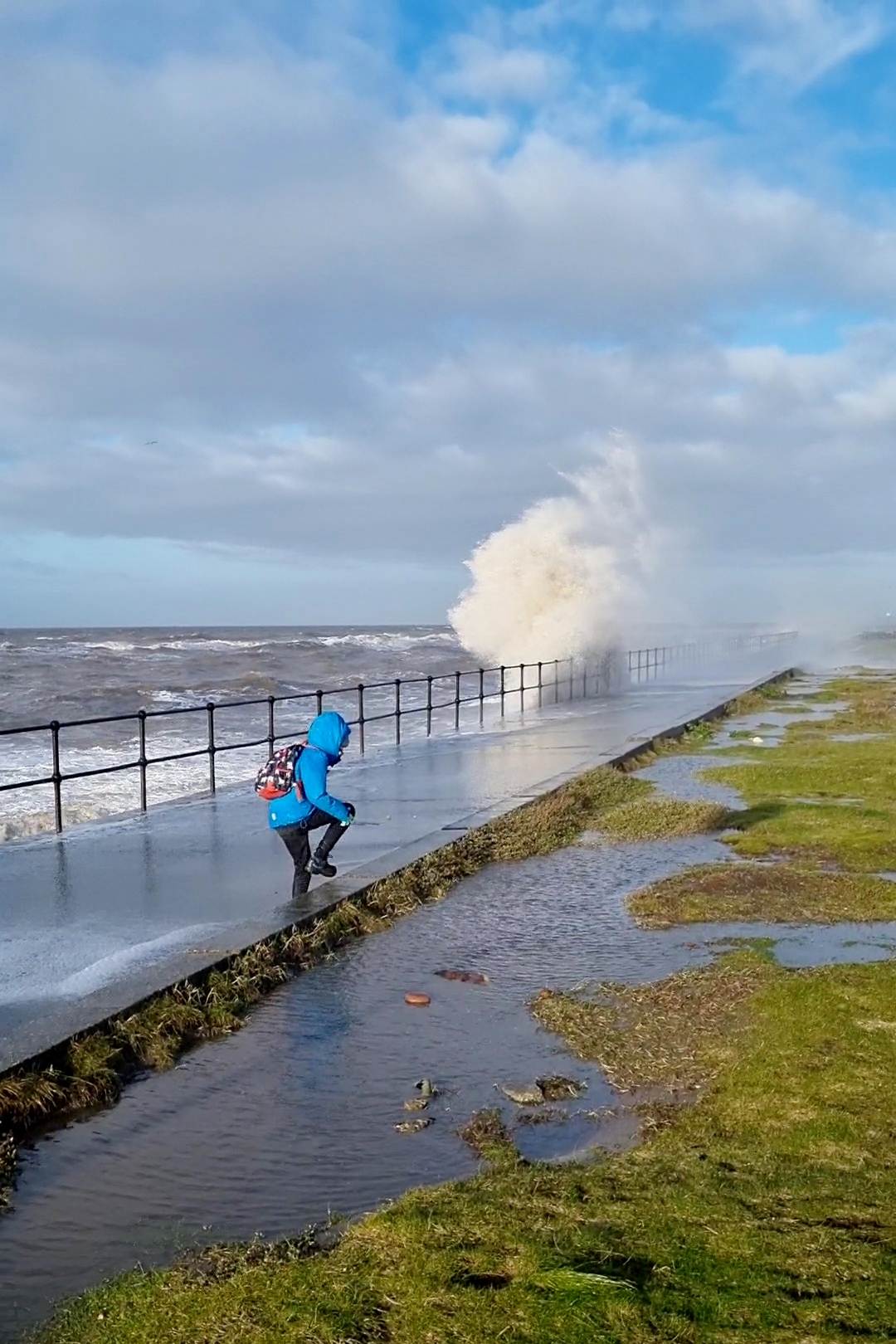 High breaking waves at Crosby beach. At high tide the waves were crashing over fence and soaking anyone who dared to walk near them! (January 2022)