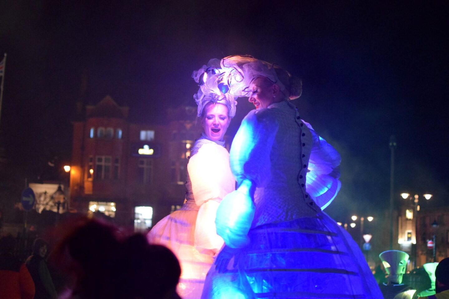 Illuminate Oldham - stilt walkers in lit dresses