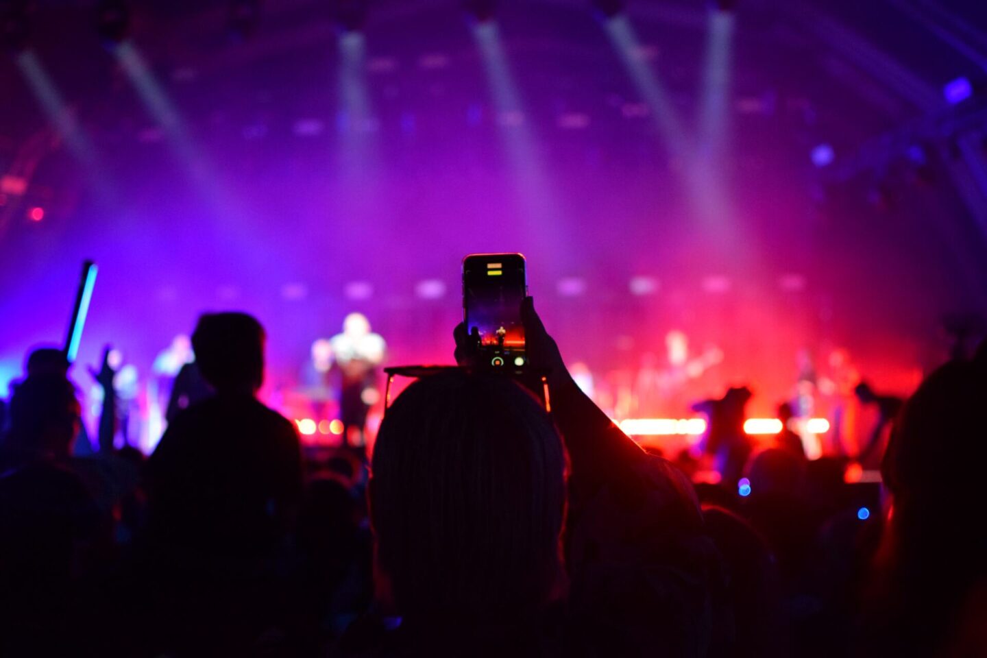 Taking a photo of Rag 'N' Bone man on stage using a mobile phone