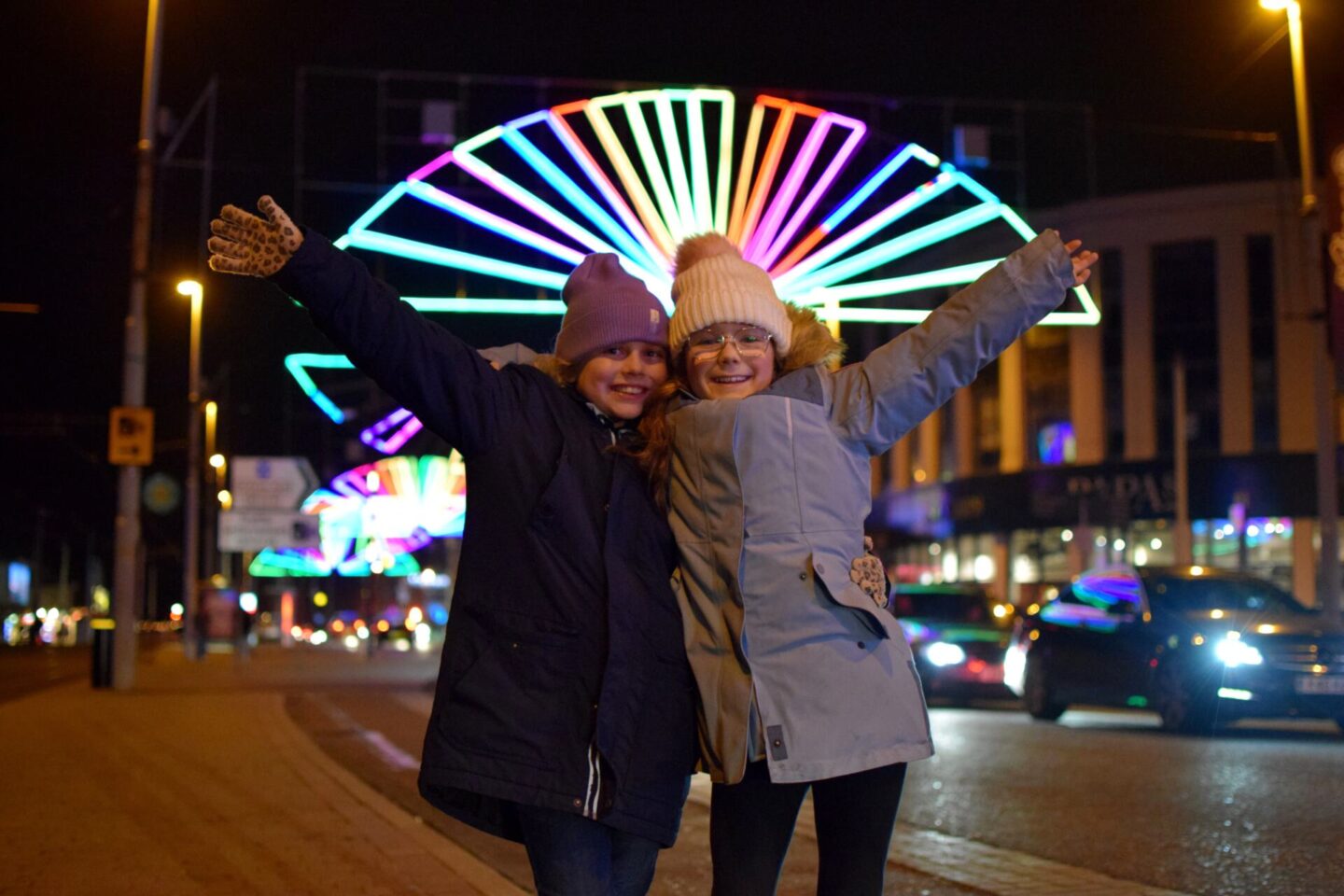 Girls standing under some of the newer Illuminations in Blackpool this year