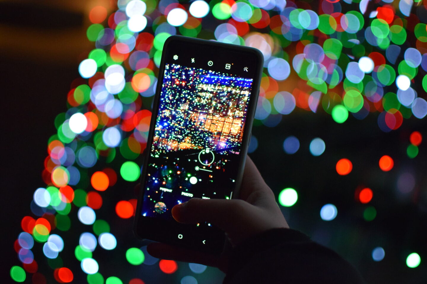 Mobile phone photographing twinkly Christmas lights