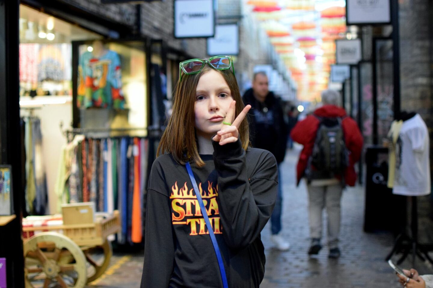 Chloe posing at Camden Market, showing off her new green ring that she'd bought on one of the stalls