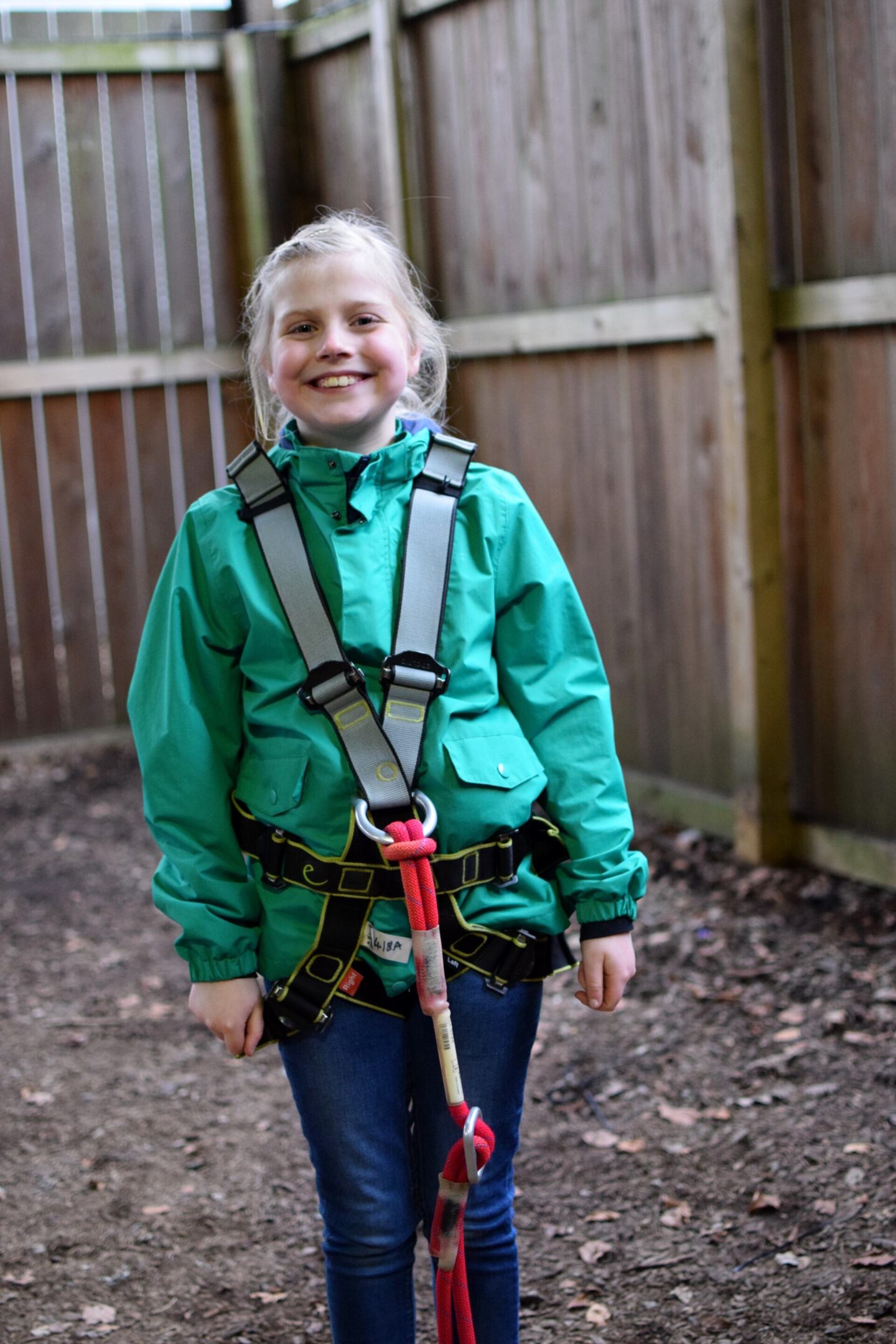 The safety harnesses are all checked by a member of staff - Amy beams at the camera, showing off her harness