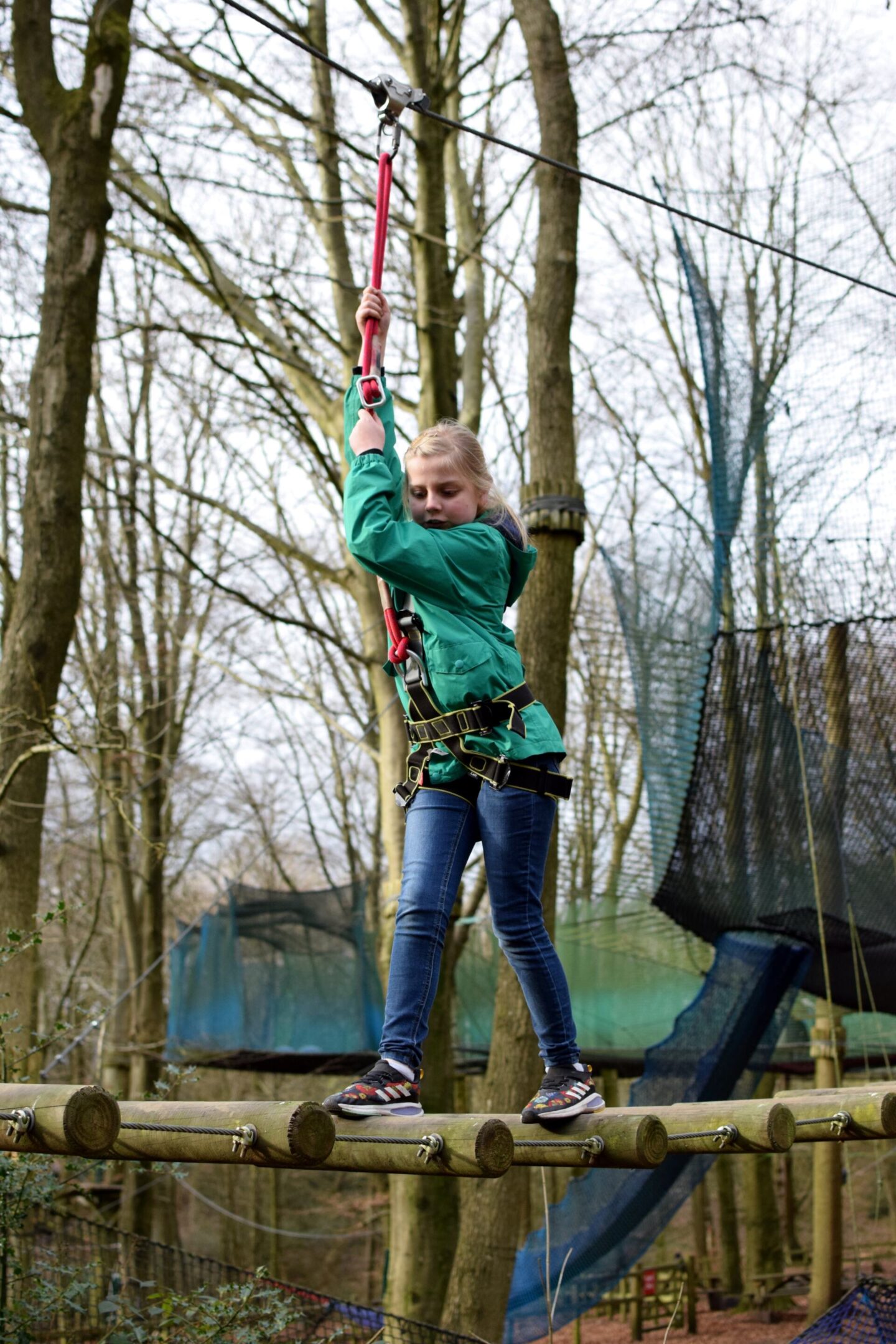 Amy concentrates on putting on foot in front of the other whilst holding on tightly to her harness