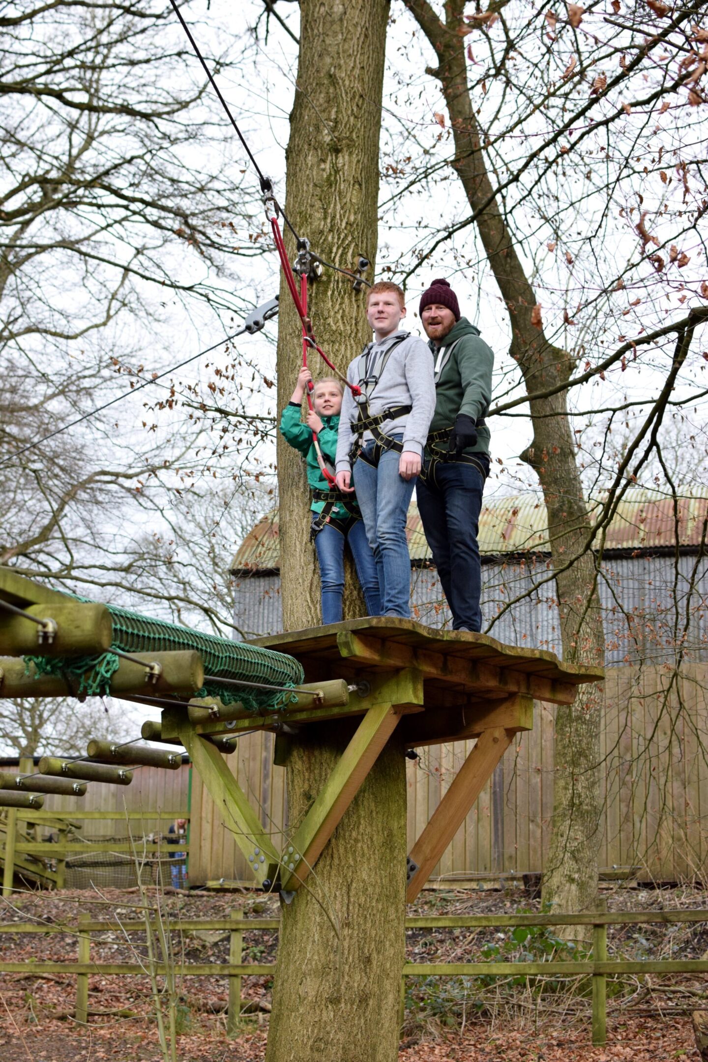 Dave, Ben and Amy stand on platform together watching Chloe ahead of them.
