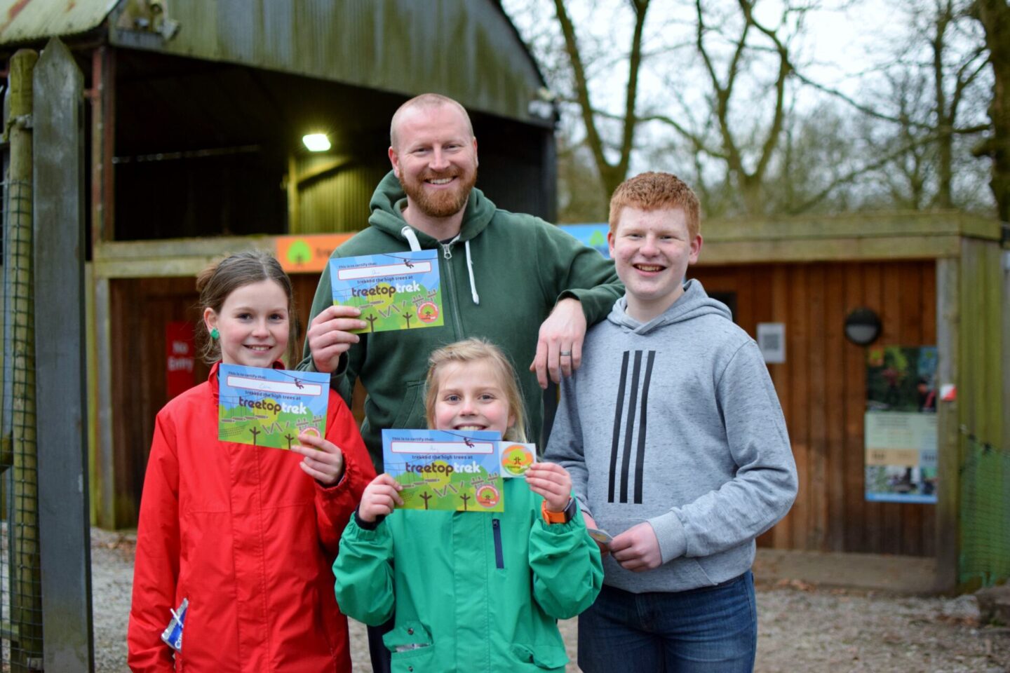 The team showing off their TreeTop Trek certificates!