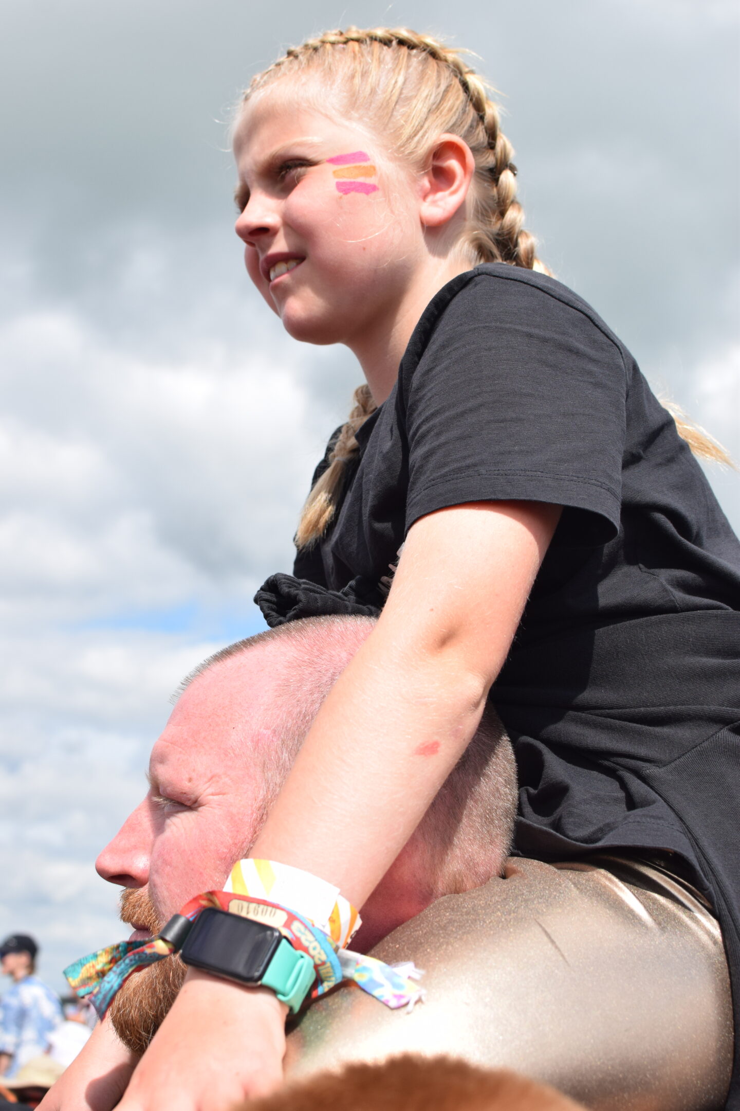 Amy say on her Dad's shoulders to get a good view at the main stage