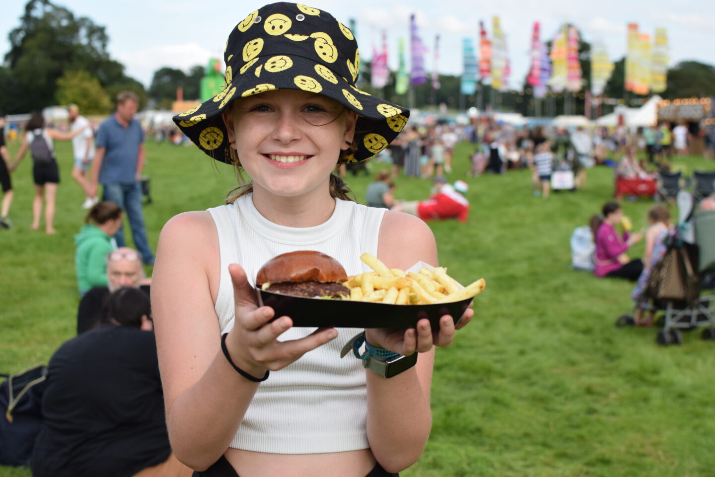 Chloe with a burger and fries at Camp Bestival Shropshire