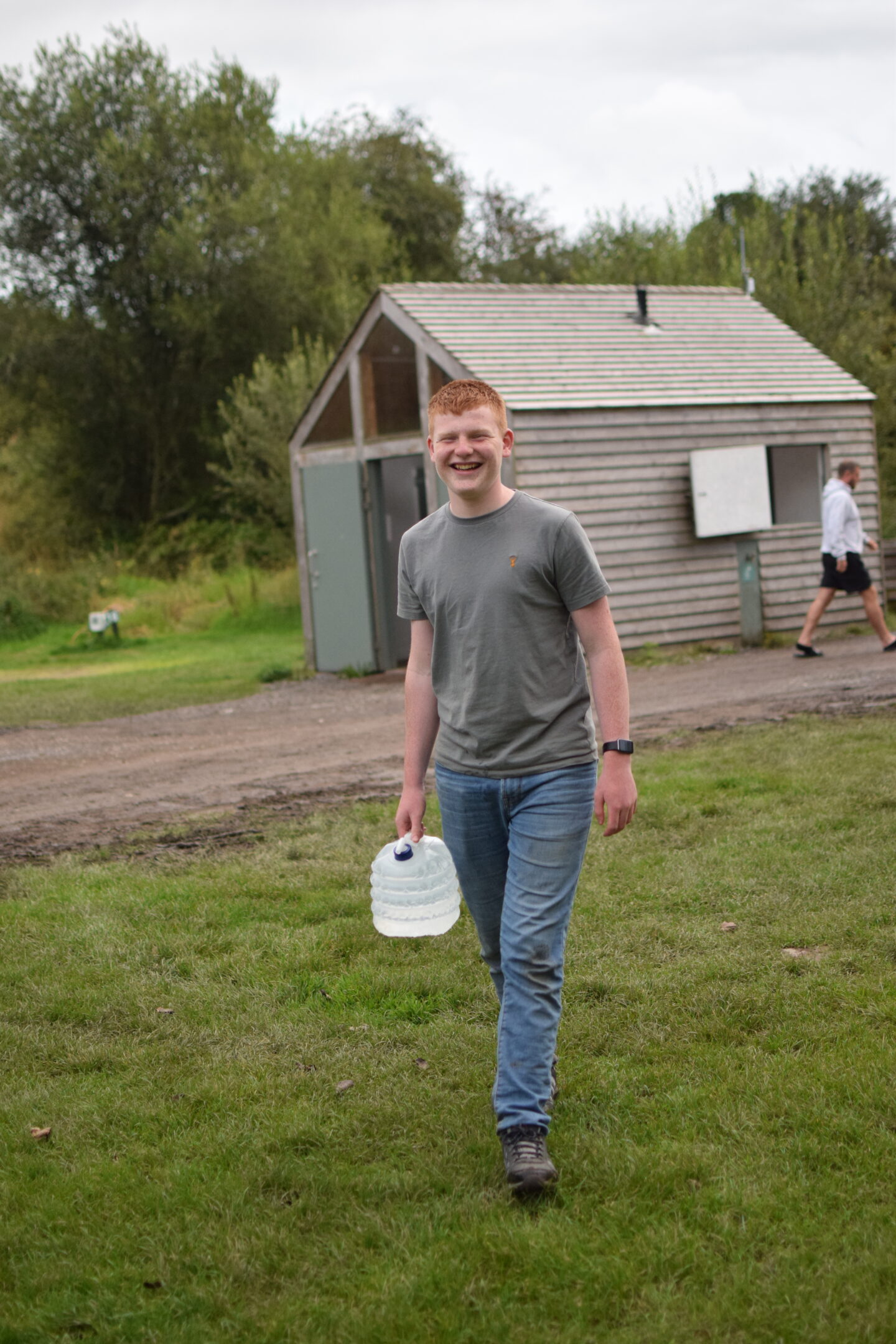 Ben fetching fresh water back from the camp tap - he's carrying the water in a large collapsible water carrier