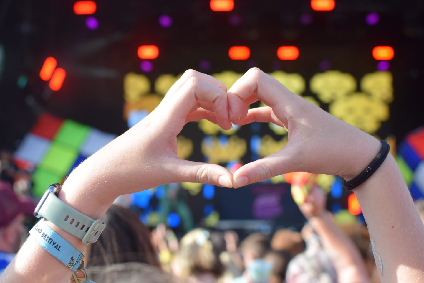 Chloe's hands making a heart in front of the main stage