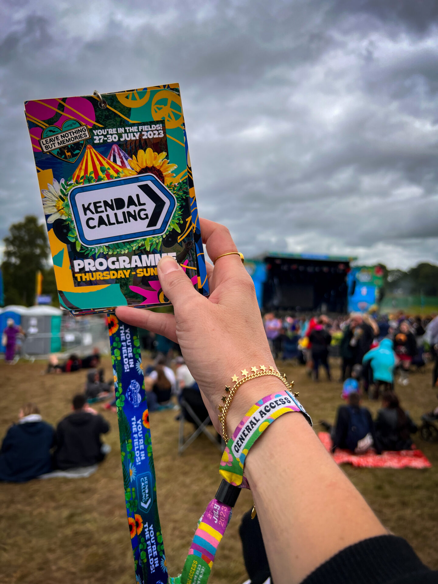 Kendal Calling lanyard in front of the stage
