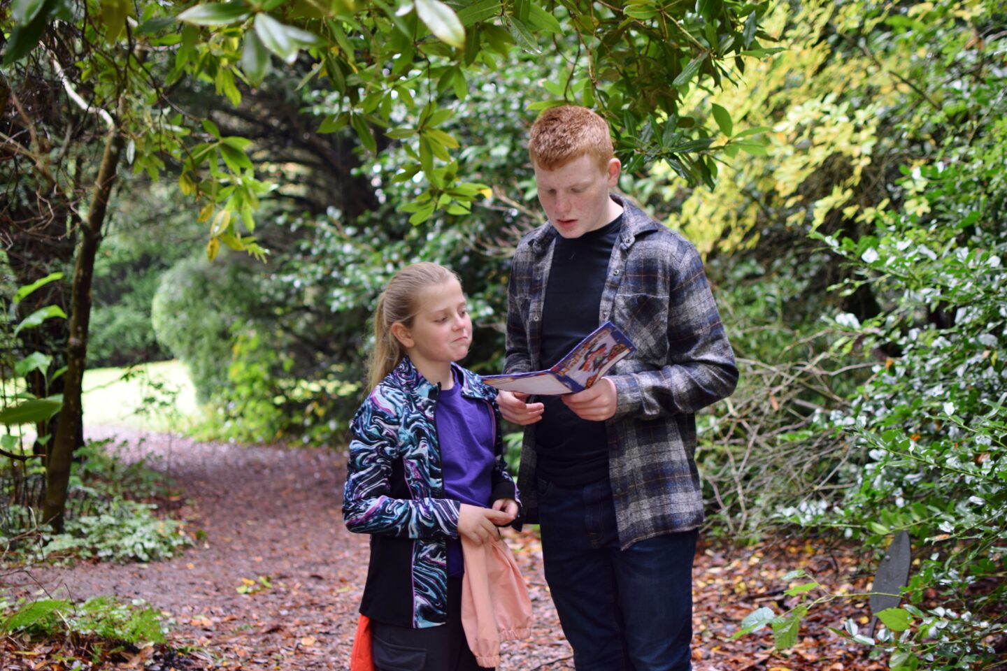 National Trust Hinton Ampner - Ben and Amy checking the trail map to find the next pumpkin