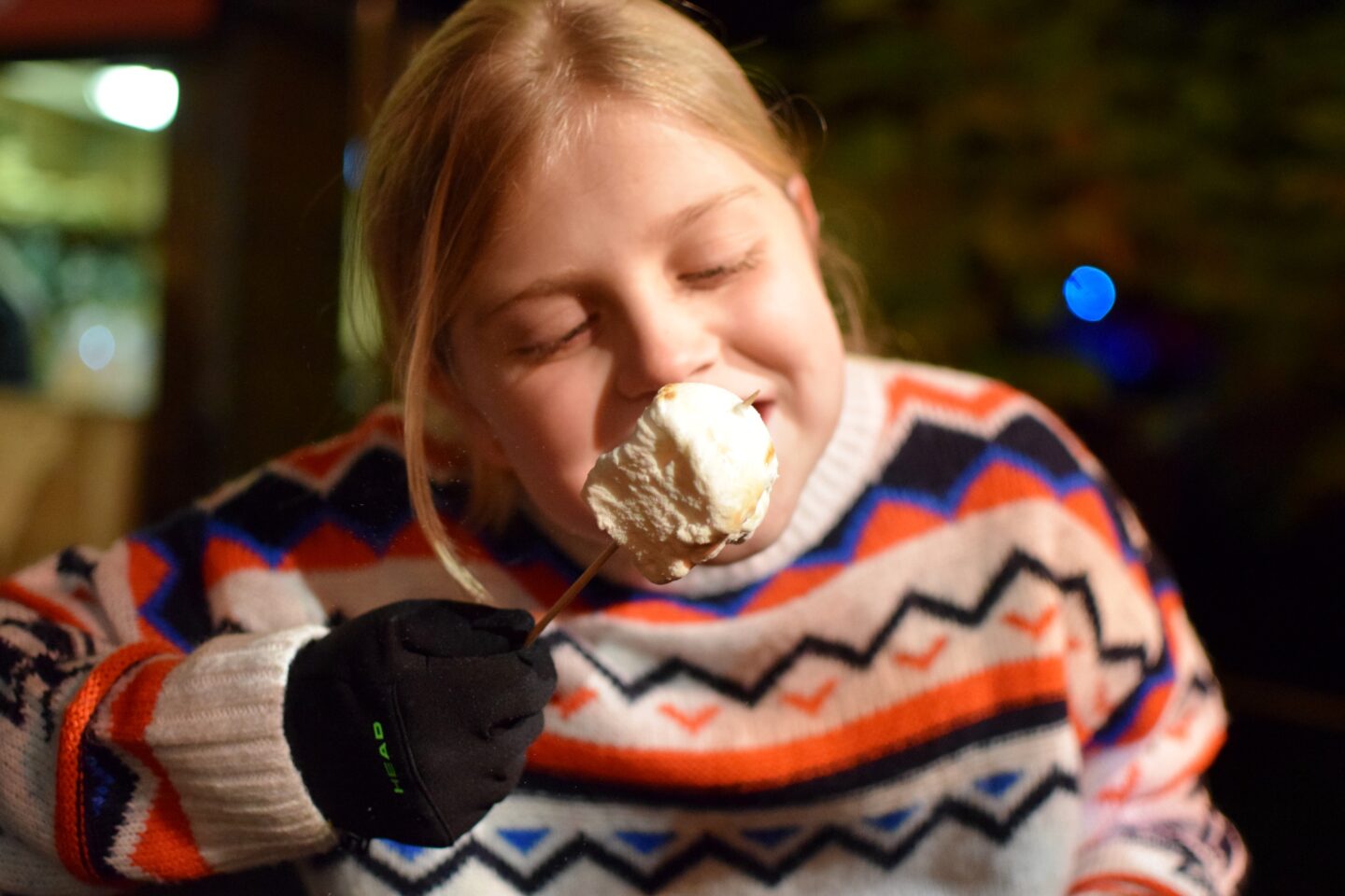 Christmas at Dunham Massey 2023 - Amy eating a toasted marshmallow