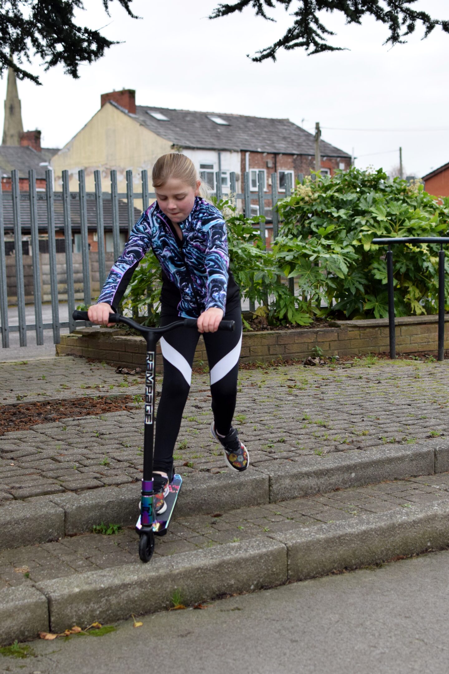 Rampage R1 - Amy trying out her new stunt scooter on some steps in the park