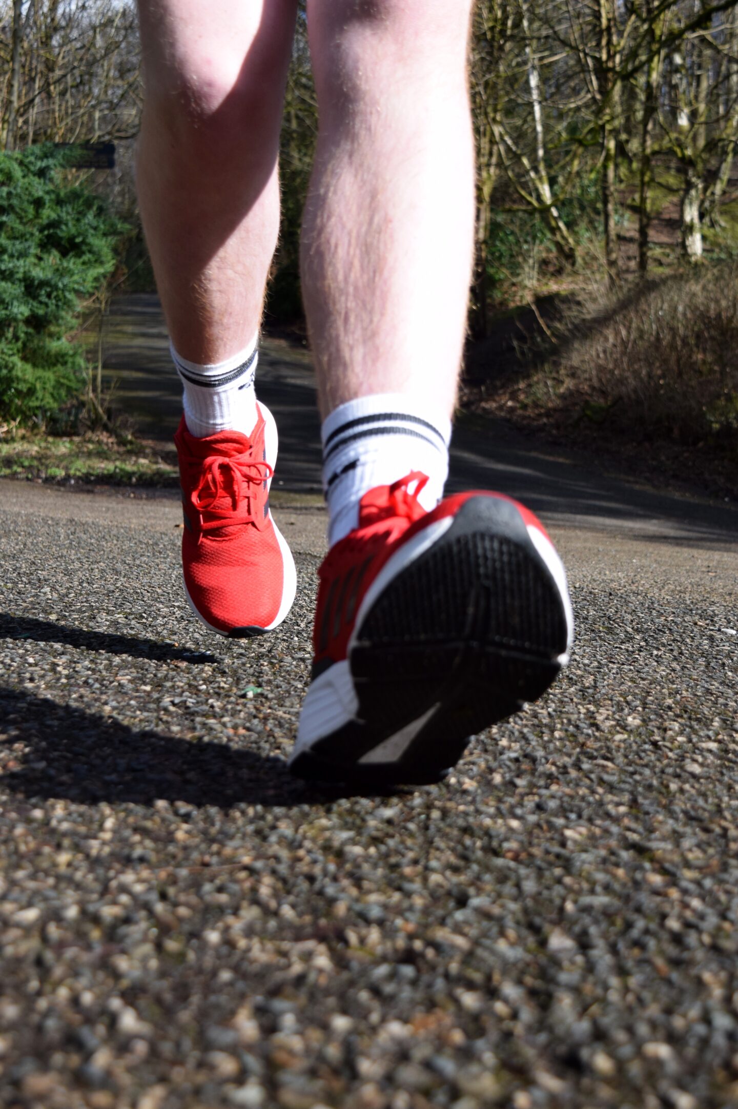 Adidas running shoes -a close up of Ben's feet as he runs towards the camera